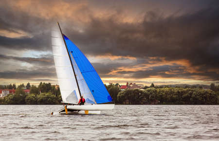 Sailboat.sailboat on the lake. On the Sunsetの写真素材