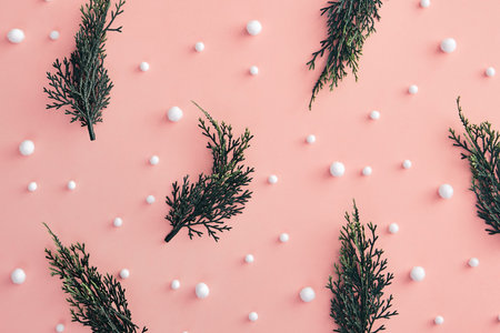 Christmas minimal concept - composition with christmas tree branch and snowball on pink background....