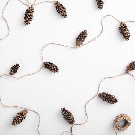 Zero waste christmas garland made from pine cone and natural jute twineの写真素材