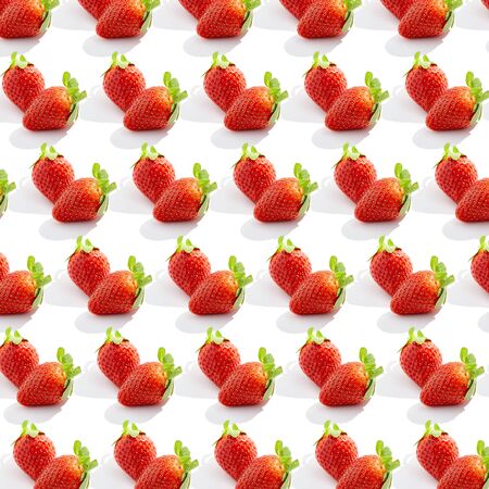 Creative trendy pattern with fresh strawberry on white. Organic healthy food conceptの写真素材