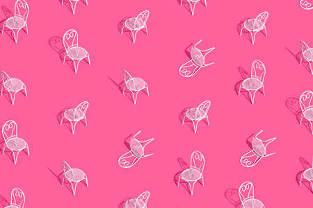 White metal chair and table on bright pink background. Creative trendy layout with sunshine and hard shadow. Cafe, restaurant, summer minimal concept.の写真素材