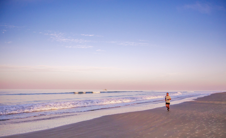 Goa, India - December, 22 2017 :Enjoying sports lifestyle. Healthy young indian man running on the sea shore.のeditorial素材
