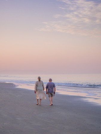 Goa, India - December 22, 2017 : Senior man and woman couple taking a walk at beautiful sunny morning at South Goa beachのeditorial素材