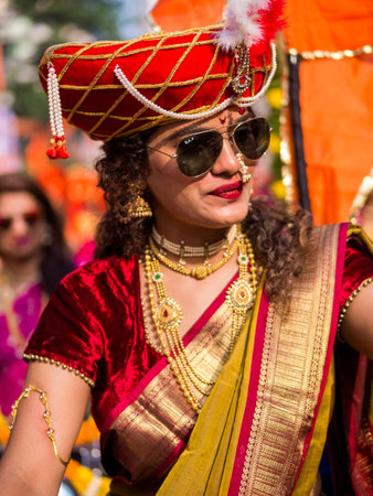 Mumbai, India - MARCH 18, 2018 : A beautiful indian female dressed in traditional attire driving a...