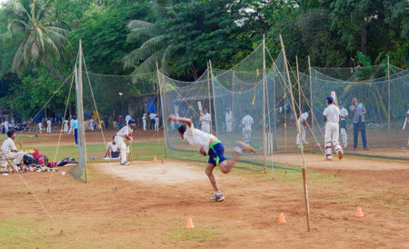 Mumbai, India - April 21, 2018: Unidentified boy practicing batting to improve cricketing skills at...