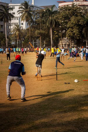 MUMBAI, INDIA - DECEMBER 4, 2016 : Young boys playing cricket with tennis ball at Mumbai groundsのeditorial素材