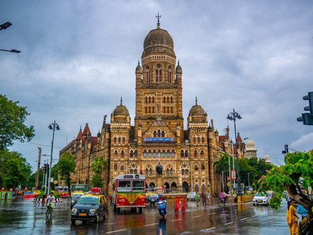 MUMBAI, INDIA - JUNE 24, 2018 : Best bus running across the street of BMC municipal building in...