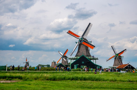 Zaanse Schans, Holland - August 26, 2018 : Traditional dutch windmills and houses near the canal in Zaanse Schans, Netherlandsのeditorial素材