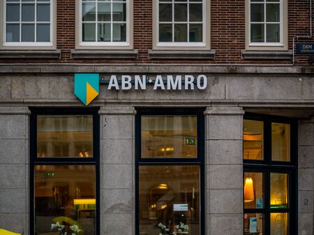 Amsterdam, Netherlands - August 26, 2018: Brand name logo ABN AMRO bank on local branch office in Amsterdamのeditorial素材