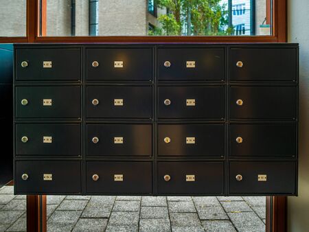 modern metallic mail box mail room in share common area space of condominium apartment flat unit mansionのeditorial素材