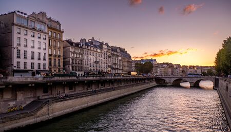 Paris, France - August 14, 2018 : Paris cityscape with Seine river and old buildings at sunset.のeditorial素材