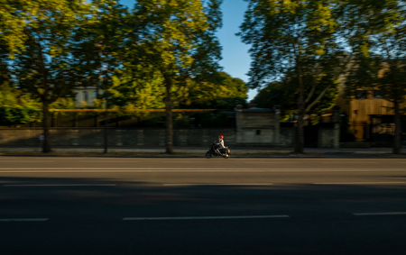 Paris, France - August 15, 2018 : A man driving scooter on streets of Parisのeditorial素材
