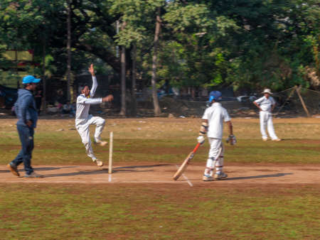 Mumbai, India - December 14, 2019: Indias most famous sport Cricket practiced by kids at local Mumbai groundのeditorial素材