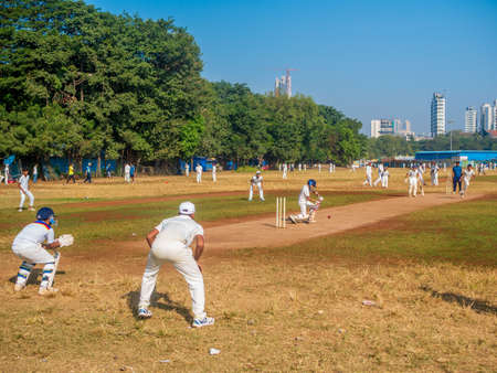 Mumbai, India - December 14, 2019: Indias most famous sport Cricket practiced by kids at local Mumbai groundのeditorial素材