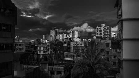 Mumbai, India - July 26, 2020 : Mumbai Cityscape, Tall residential buildings and small buildings describing lifestyle in Mumbai. Beautiful cloudy sky.のeditorial素材