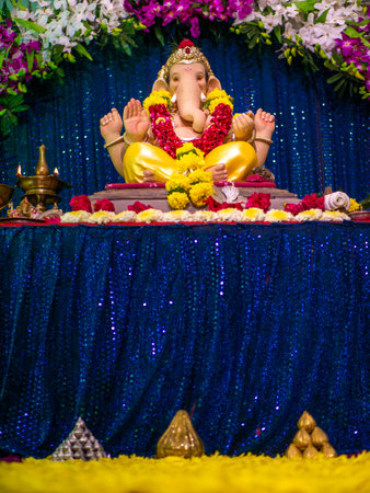 Lord Ganesha decorated with orchid flowers
