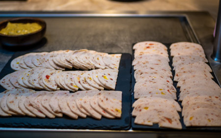 Beautifully decorated slices of Chicken Salami. Preparation for the banquet. Buffet, serving.