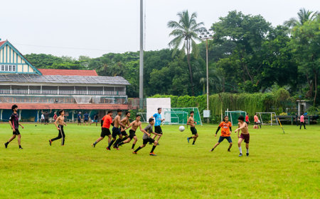 MUMBAI, INDIA - October 2, 2021 - Young boys playing unorganized football Match at Mumbai ground,...