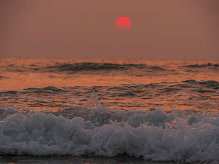 Beautiful sunset at sea shore of Coastal Maharashtraの写真素材