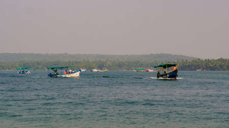 Malvan, INDIA - December 23, 2021 : Unidentified tourists enjoying boat ride in  Devbagh beach, Sindhudurga, a place listed in 30 favorite tourist destination around worldのeditorial素材