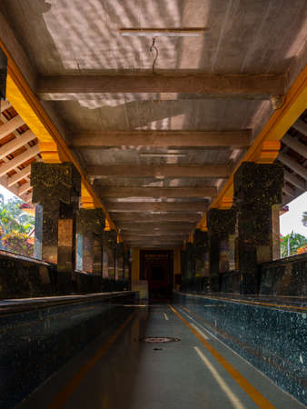 Malvan, INDIA - December 19, 2021 : Entrance of Sateri devi Jala mandir, an ancient temple surrounded by a water pond situated at Konkan, coastal maharashtra. Vertical or portrait orientationのeditorial素材