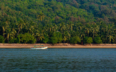 Malvan, INDIA - December 23, 2021 : Unidentified tourists enjoying boat ride in  Devbagh beach, Sindhudurga, a place listed in 30 favorite tourist destination around worldのeditorial素材