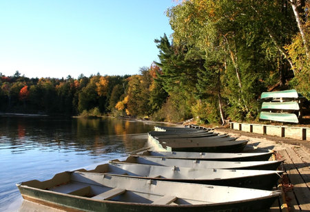 Boats in a small lake during autumn timeの写真素材