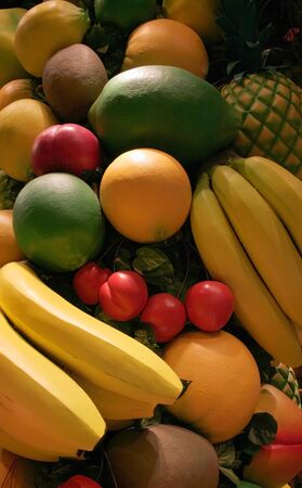 Different and colorful fruit objects including oranges bananas pine appleの写真素材