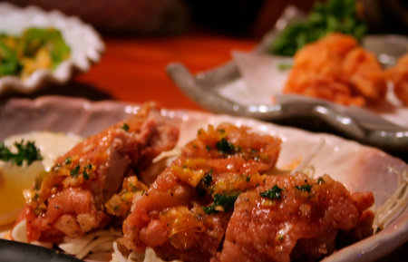 Japanese style fried chicken dish in a restaurantの写真素材