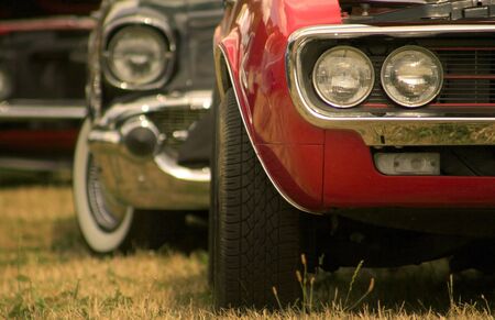Close up shot of muscle cars that are lined up one after the otherの写真素材