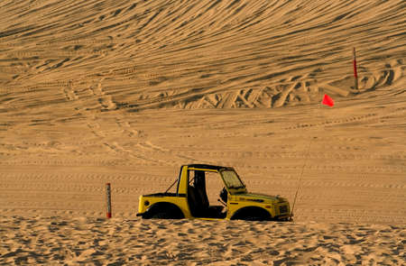 Single off road vehicle parked in the middle of desertの写真素材