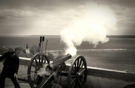 Firing a cannon ball on fort in black and whiteの写真素材