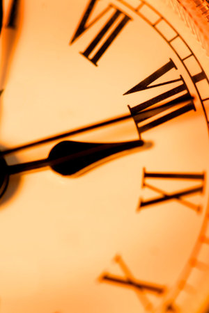 Close up shot of antique clock in sepia color tone