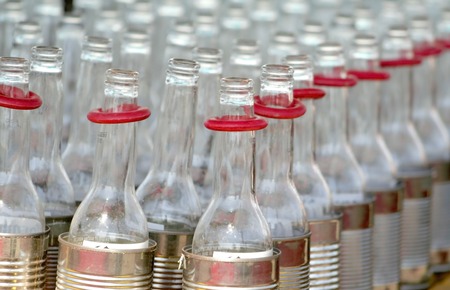 Many empty beer bottles in a row shallow depthの写真素材