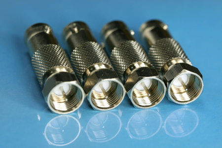 close up of Four electronic probes on blue surfaceの写真素材