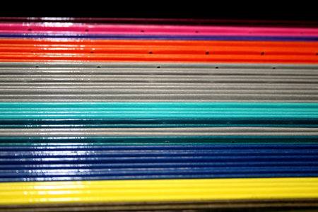 bunch of coloful files in the cabinet
