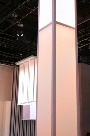 An abstract of Tall lamps in an auditorium