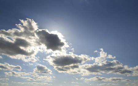 Morning sun light rays piercing through the clouds