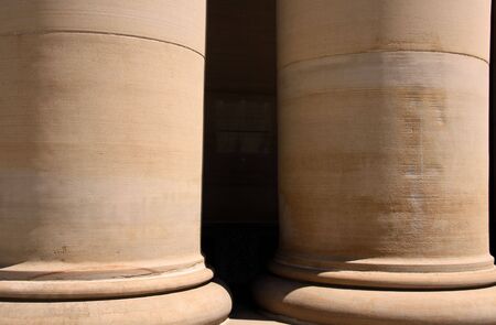 Two huge pillars of an historic court houseの写真素材