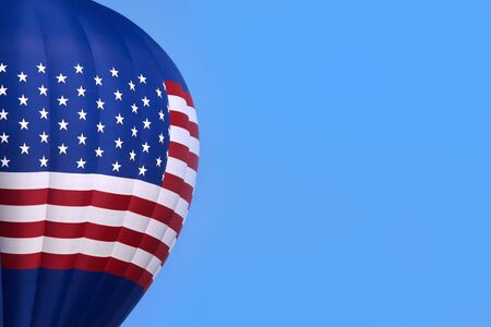hot air balloon in the sky with american flag designの写真素材