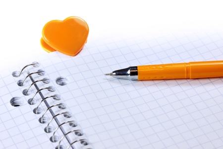 Blank note book with pen and Heart shaped clipの写真素材