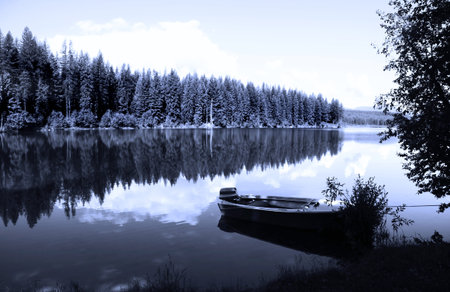 Single boat in the river in black and whiteの写真素材
