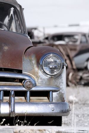 Old rustic cars in a scrap yard の写真素材