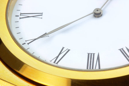 macro shot of clock with golden dial