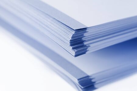 Stack of big book papers on white backgroundの写真素材