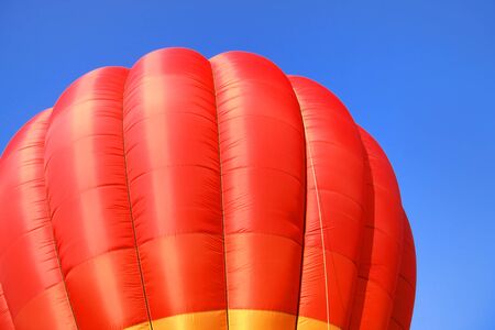 Hot air balloon against blue sky backgroundの写真素材