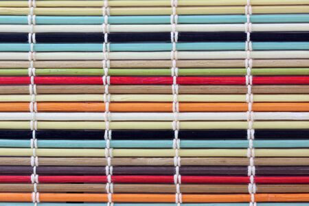 Colorful bamboo dinning mat backgroundの写真素材