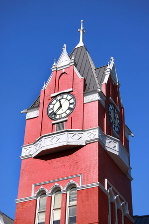 Historic clock tower against blue skyの写真素材