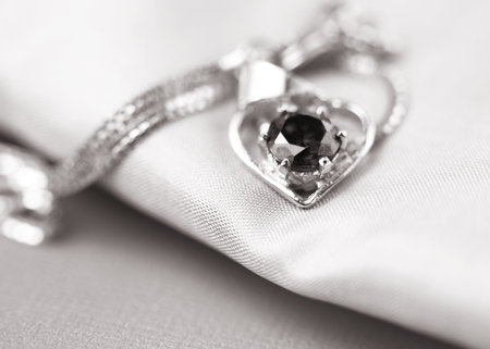 Close up shot of a pendent on satin cloth
