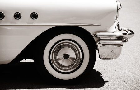 Side view of classic car with front wheel